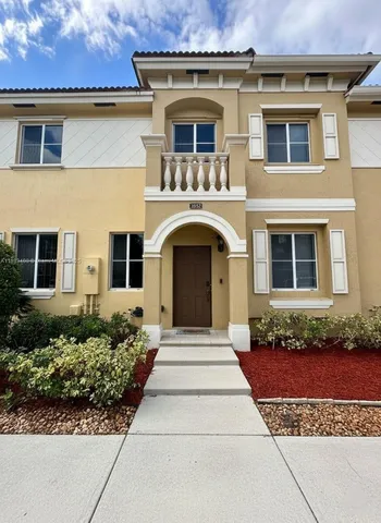 front view of a house with a garden