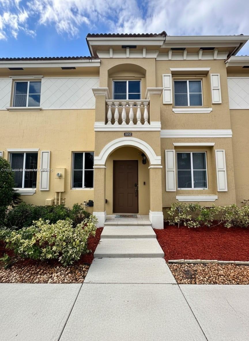 1832 Southwest 89th Terrace Miramar, FL 33025 - Photo 3 of 28 front view of a house with a garden