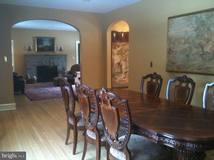 5606 Rockspring Road Baltimore, MD 21209 - Photo 3 of 5 a view of a dining room with furniture and wooden floor