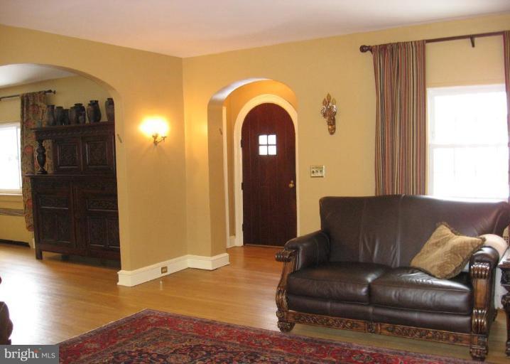 5606 Rockspring Road Baltimore, MD 21209 - Photo 4 of 5 a living room with furniture and a window