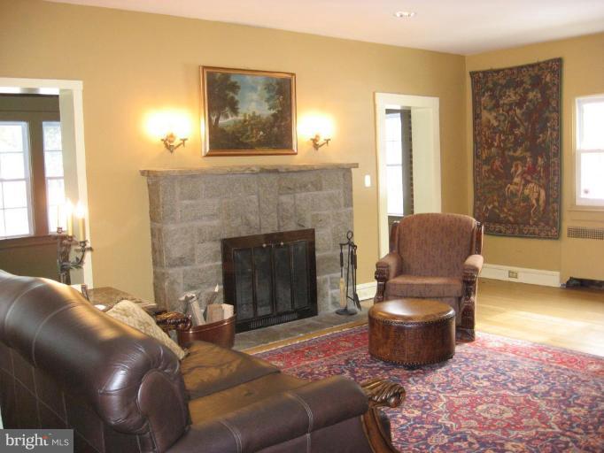 5606 Rockspring Road Baltimore, MD 21209 - Photo 5 of 5 a living room with furniture and a fireplace