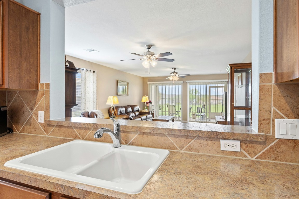 104 Monument Hill Trail Georgetown, TX 78633 - Photo 27 of 27 a view of a kitchen with a sink and a living room