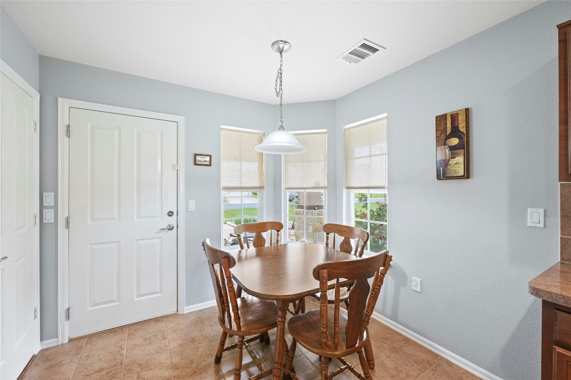 104 Monument Hill Trail Georgetown, TX 78633 - Photo 9 of 27 a view of a dining room with furniture window and outside view