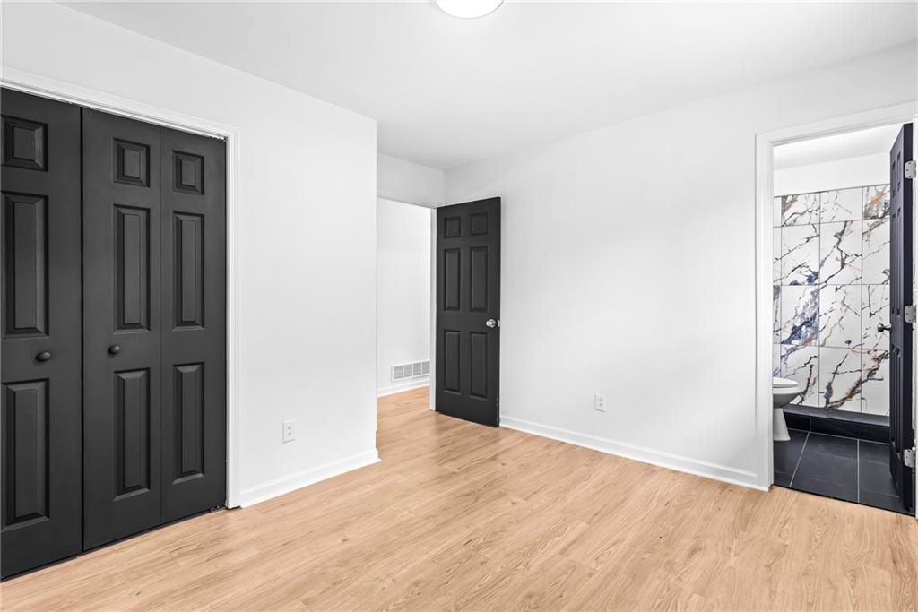 264 Howell Terrace Southwest Atlanta, GA 30331 - Photo 19 of 22 a view of a hallway with wooden floor and closet