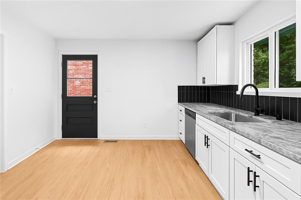 264 Howell Terrace Southwest Atlanta, GA 30331 - Photo 5 of 22 a view of a kitchen with a sink and dishwasher