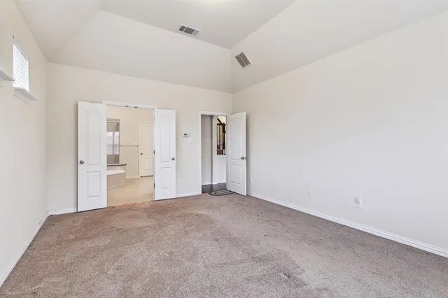 a big room with closet and windows