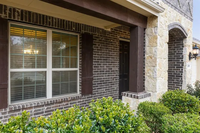 a view of a door with a door and wooden floor