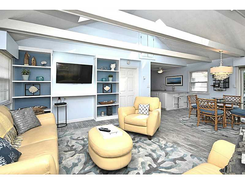 4 Standish Road Jamestown, RI 02835 - Photo 6 of 24 Living Room. Nice built ins and new porcelain tile flooring in this area!