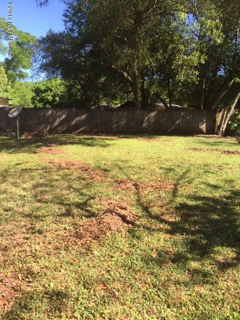 1427 King Arthur Road Jacksonville, FL 32211 - Photo 27 of 37 a view of yard with swimming pool and trees
