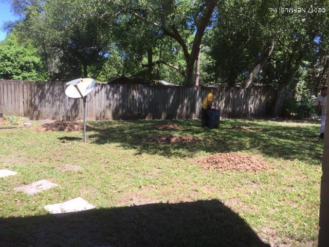 1427 King Arthur Road Jacksonville, FL 32211 - Photo 28 of 37 a backyard of a house with yard and outdoor seating