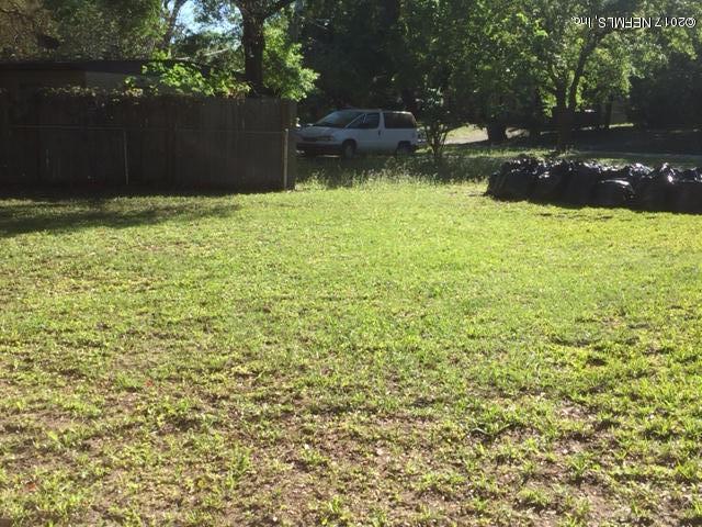 1427 King Arthur Road Jacksonville, FL 32211 - Photo 35 of 37 a backyard of a house with lots of green space