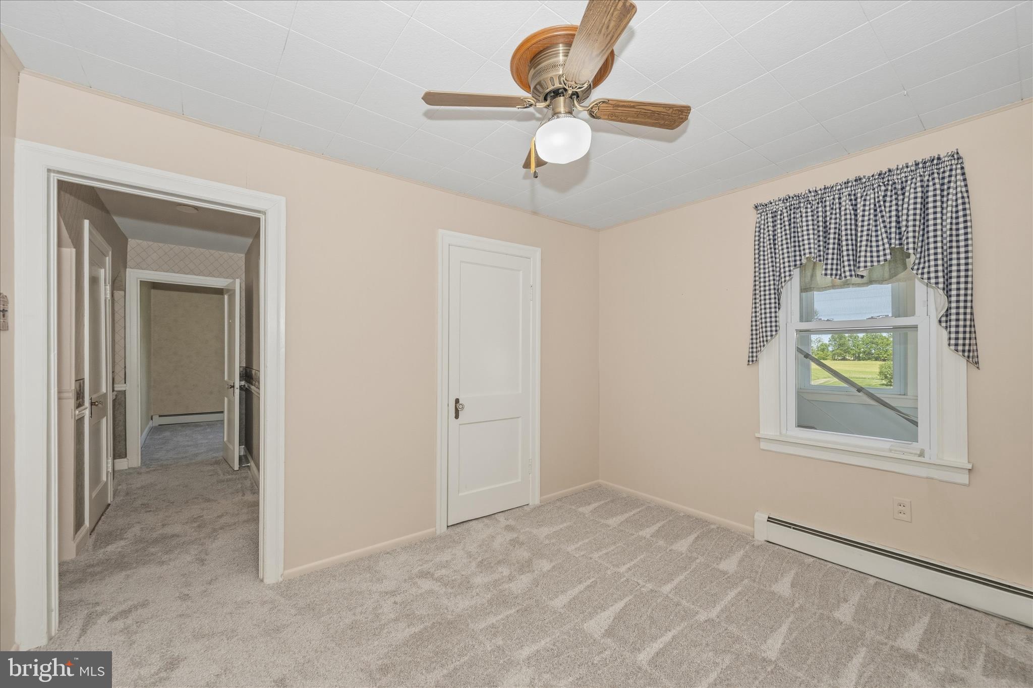 11205 Hessong Bridge Road Thurmont, MD 21788 - Photo 24 of 69 an empty room with windows and closet