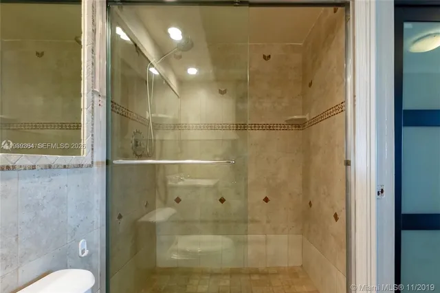 a bathroom with a shower and toilet