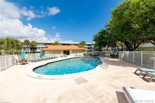 a view of a swimming pool with a patio