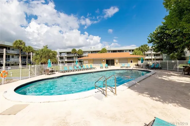 a view of a swimming pool with a patio