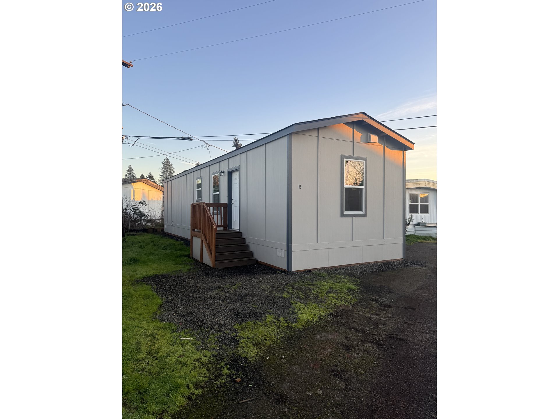 1085 West 1st Avenue, Unit R Junction City, OR 97448 - Photo 2 of 14 a view of a house with a yard