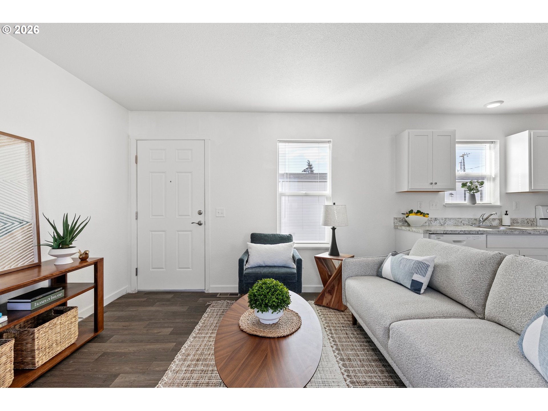 1085 West 1st Avenue, Unit R Junction City, OR 97448 - Photo 6 of 14 a living room with furniture and a dining table