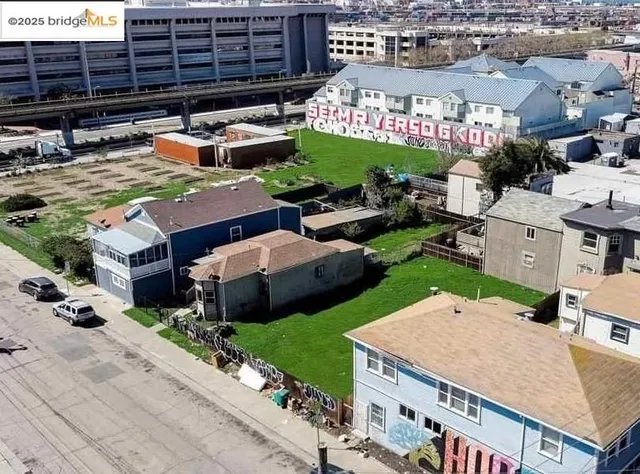 an aerial view of a house with yard swimming pool and outdoor seating