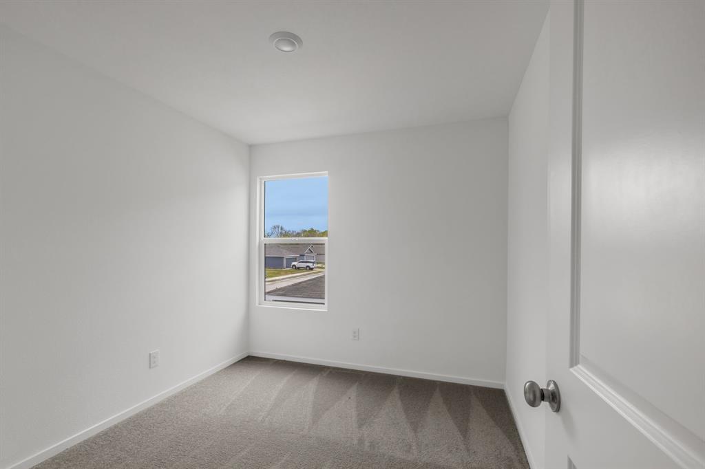 6819 Highlands Street Princeton, TX 75407 - Photo 25 of 30 an empty room with windows