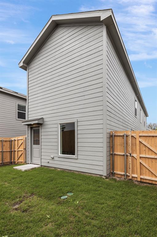 6819 Highlands Street Princeton, TX 75407 - Photo 28 of 30 a view of a house with a backyard