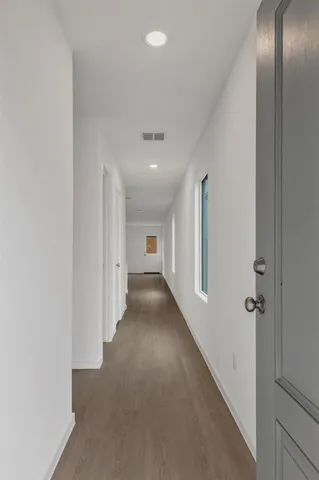 a view of a hallway with closet