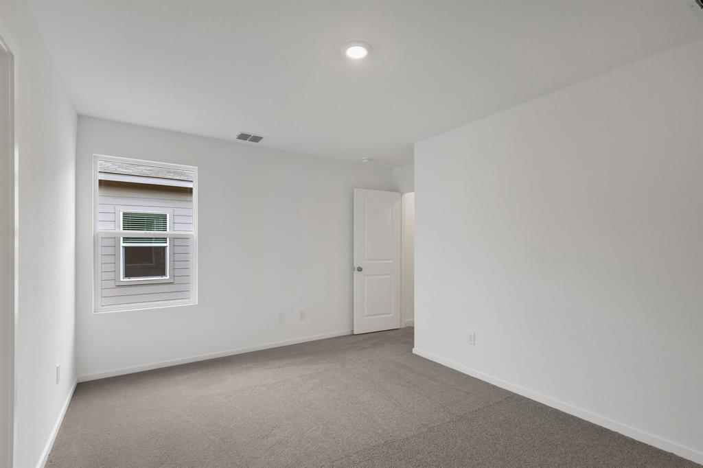 6819 Highlands Street Princeton, TX 75407 - Photo 6 of 30 a view of an empty room with a window