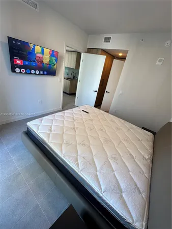a bedroom with a bed and furniture