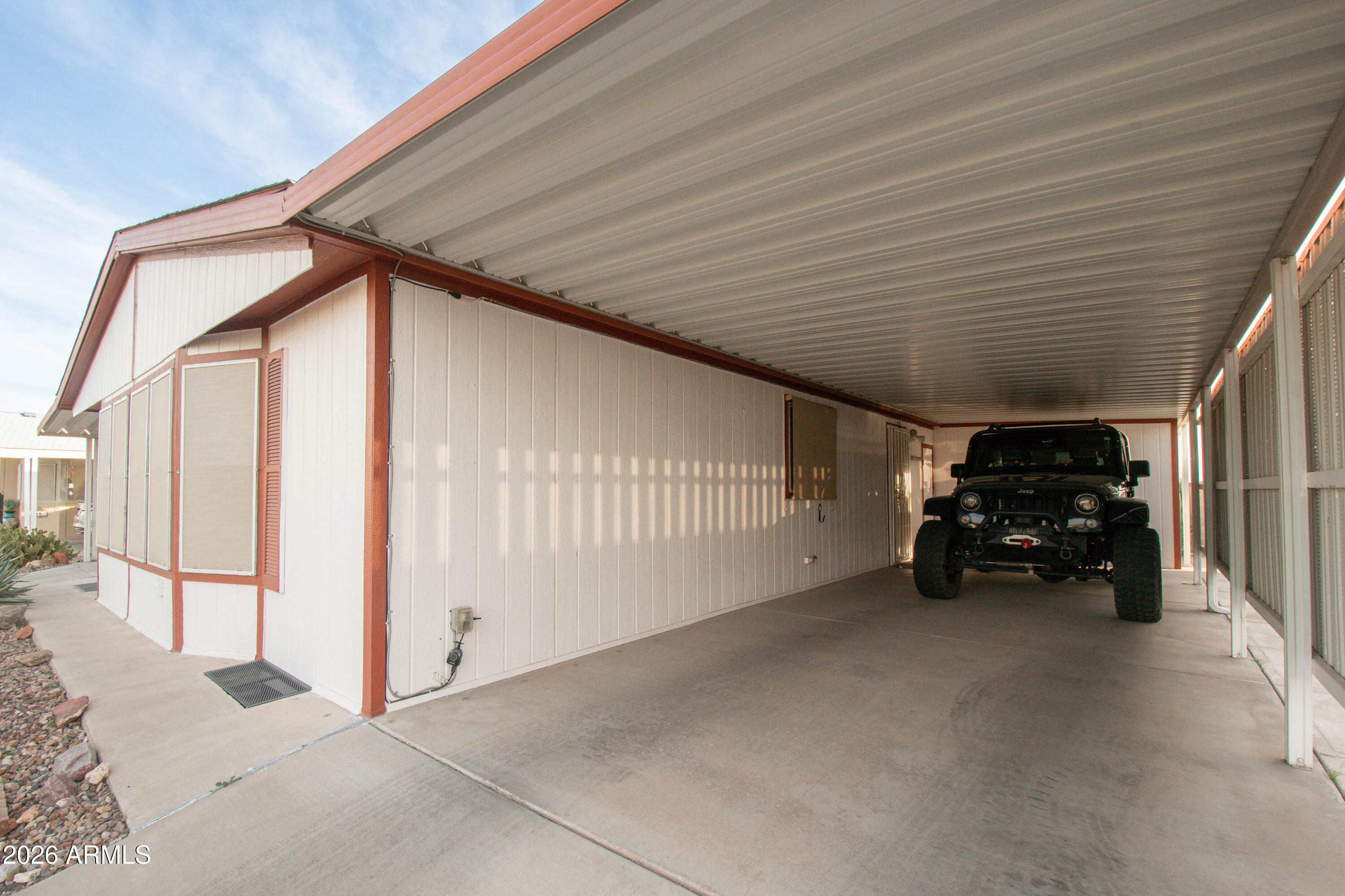3700 South Tomahawk Road, Unit 95 Apache Junction, AZ 85119 - Photo 20 of 31 a view of car parked in garage