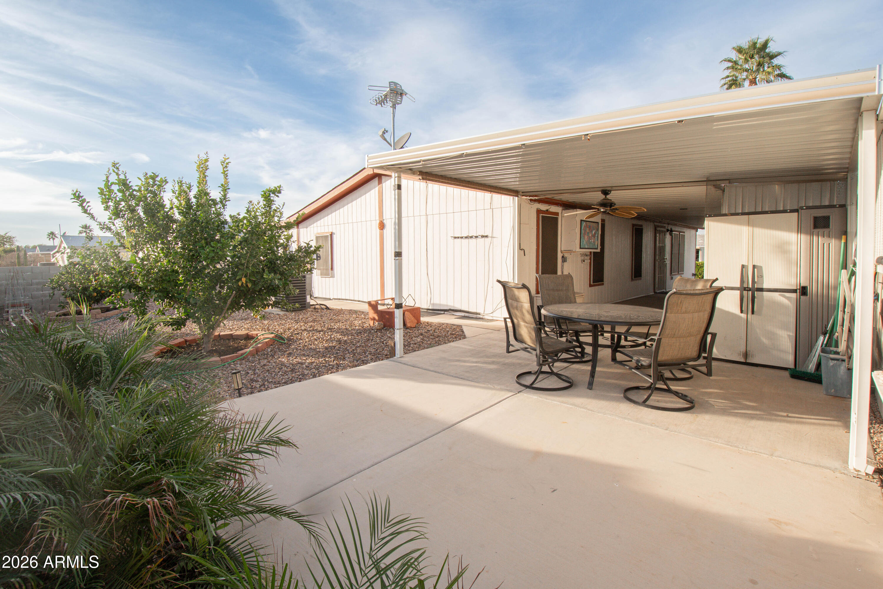 3700 South Tomahawk Road, Unit 95 Apache Junction, AZ 85119 - Photo 23 of 31 a outdoor space with a large tub and couches chair