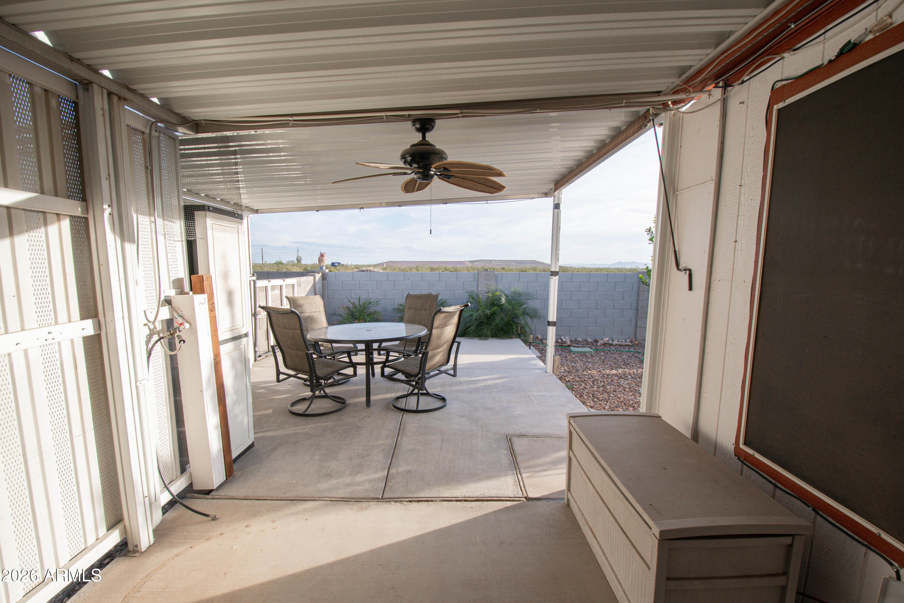3700 South Tomahawk Road, Unit 95 Apache Junction, AZ 85119 - Photo 24 of 31 a dining room with furniture and a window