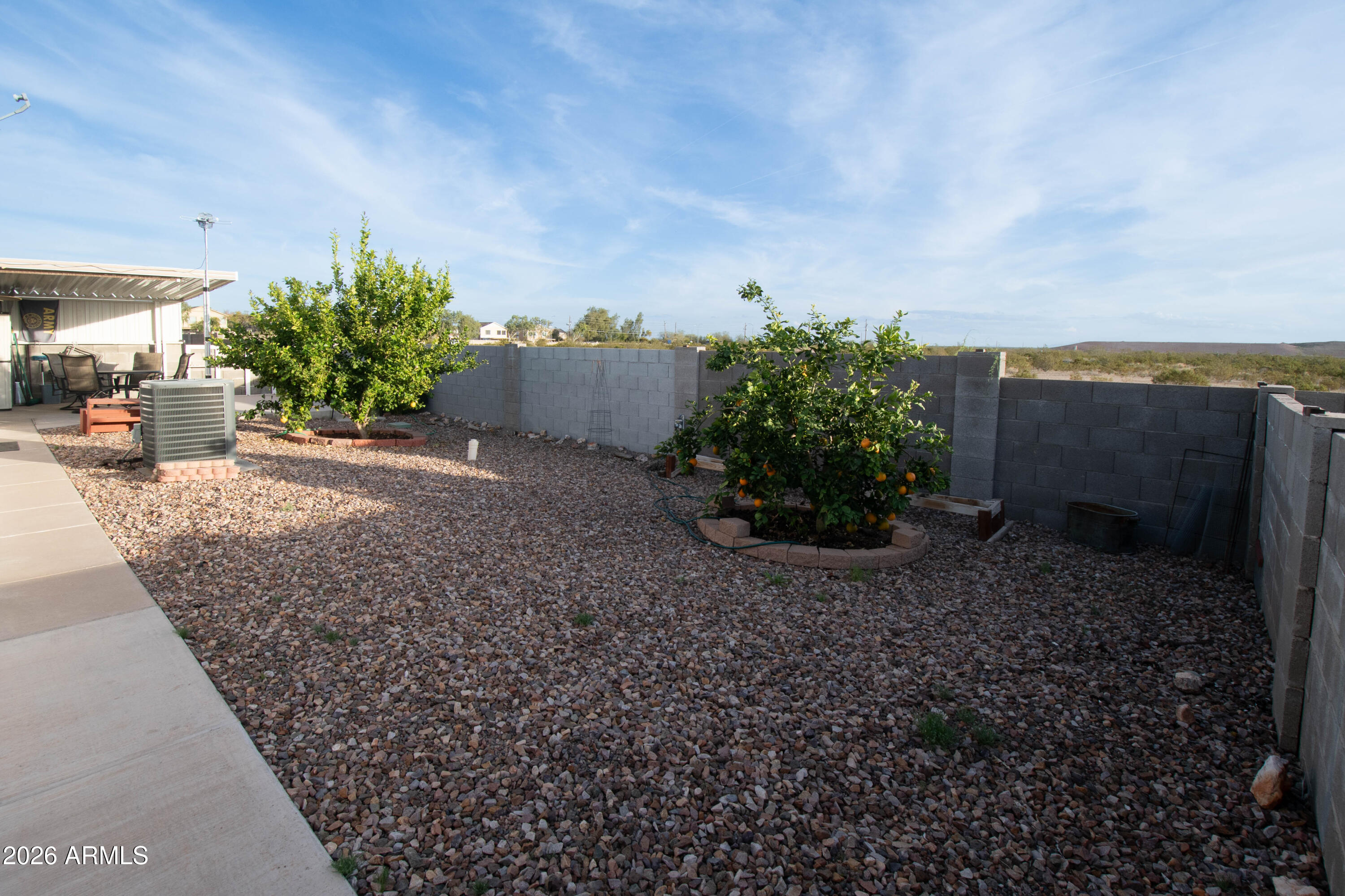 3700 South Tomahawk Road, Unit 95 Apache Junction, AZ 85119 - Photo 25 of 31 a plant is in front of a house