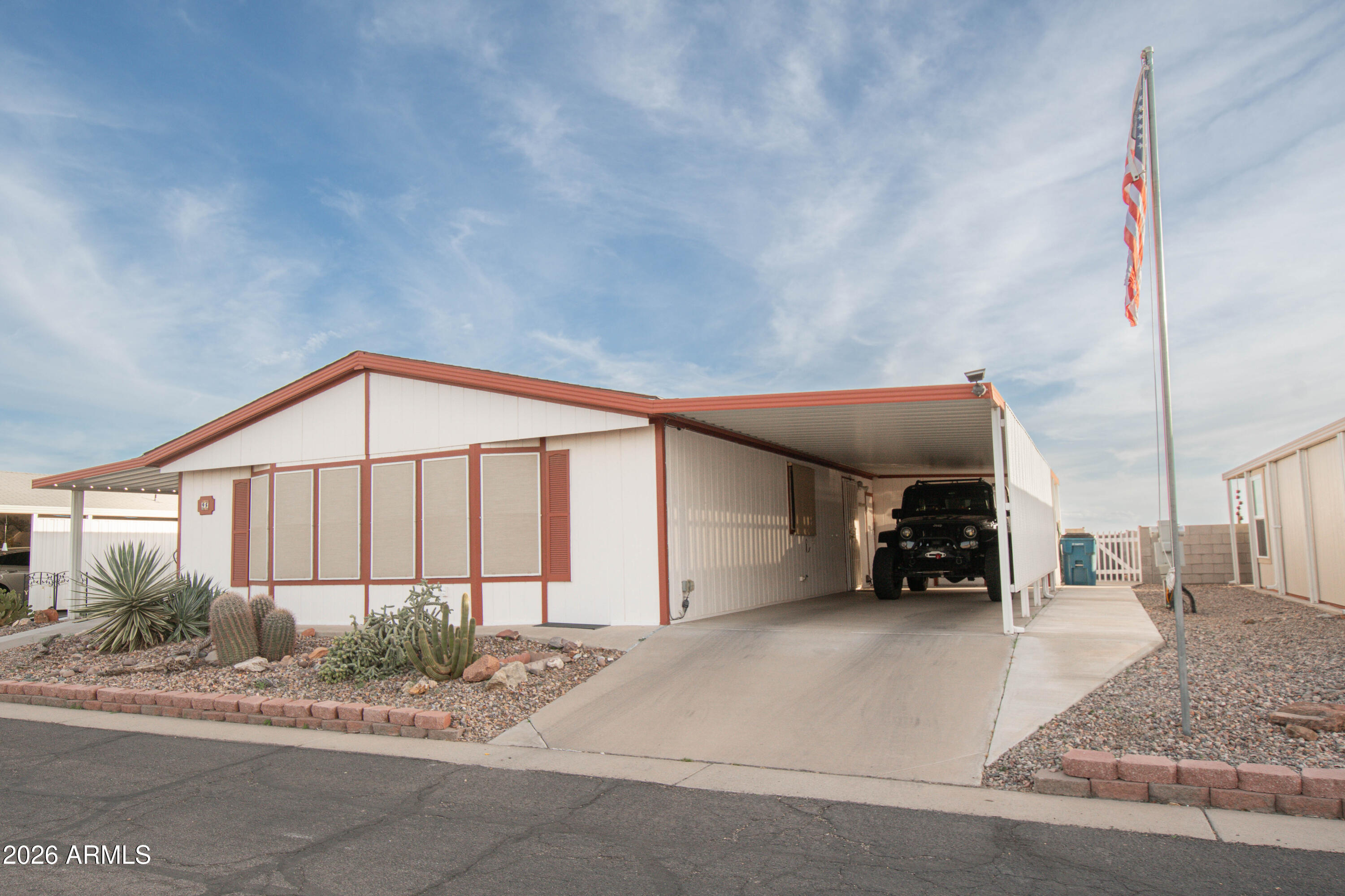 3700 South Tomahawk Road, Unit 95 Apache Junction, AZ 85119 - Photo 3 of 31 a view of a house with a yard