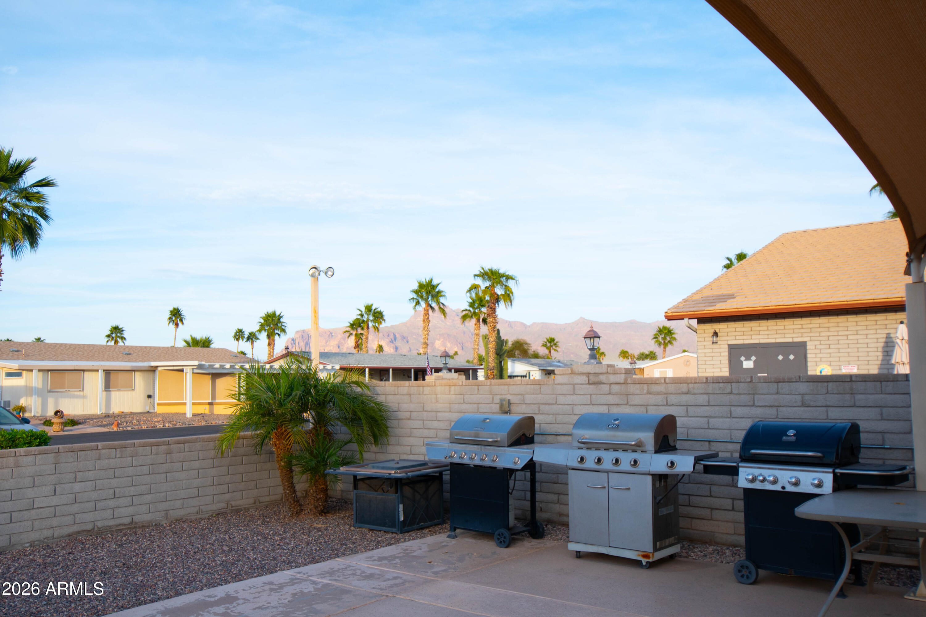 3700 South Tomahawk Road, Unit 95 Apache Junction, AZ 85119 - Photo 31 of 31 a view of a terrace with chairs