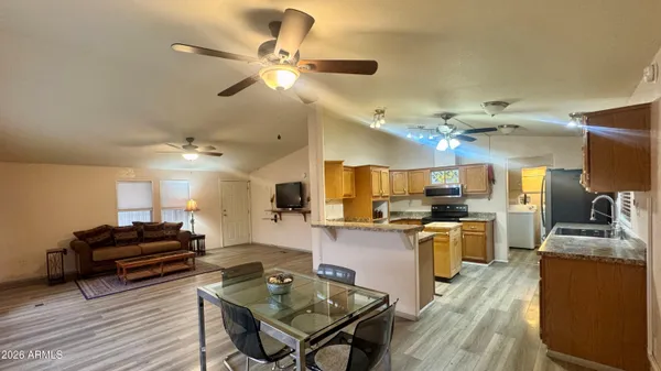 a kitchen with cabinets a counter top space a sink and appliances