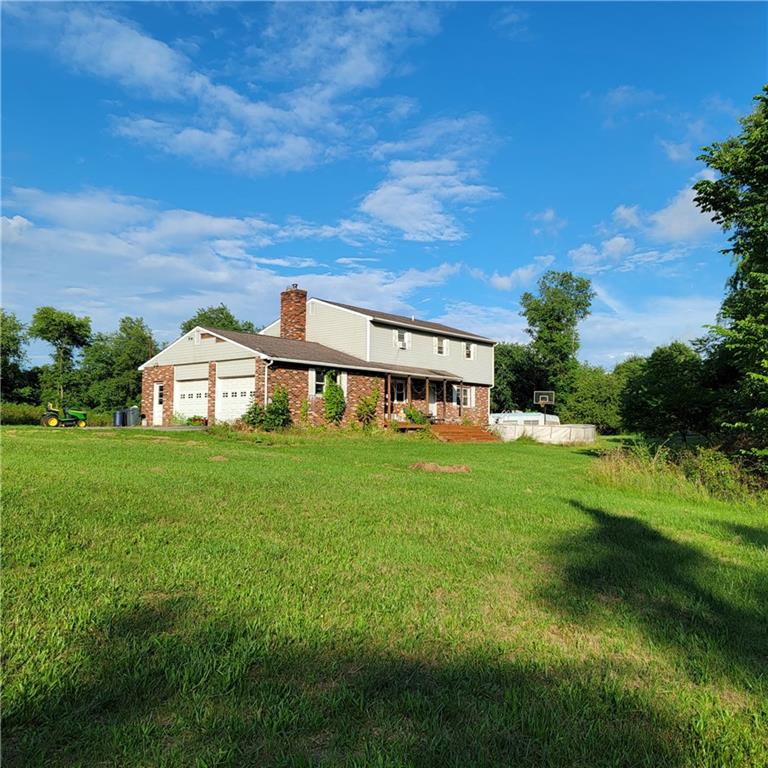 241 Tate Road Hookstown, PA 15050 - Photo 1 of 11 a view of a house with a big yard plants and large trees