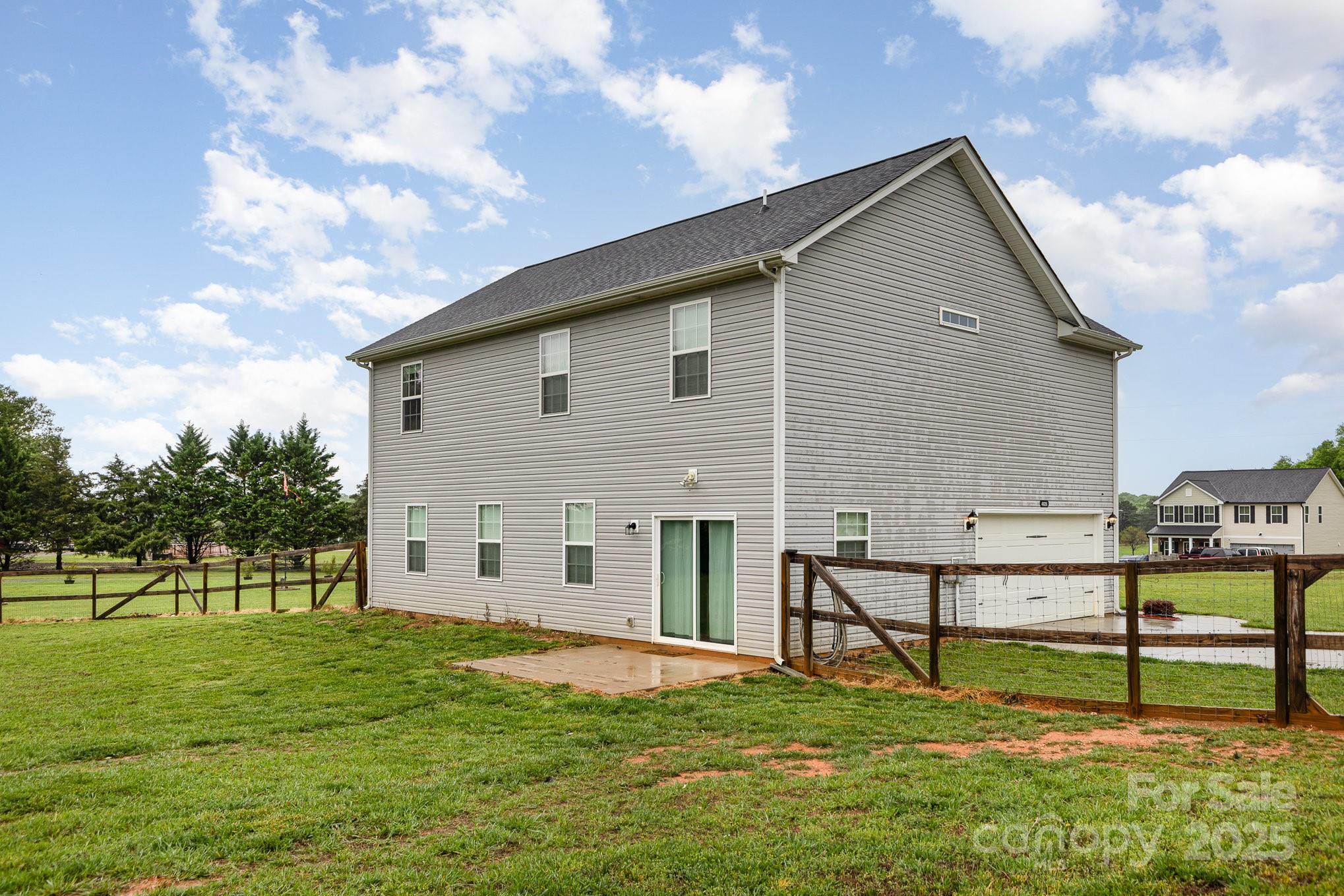 4026 Pigg Mattox Road Monroe, NC 28112 - Photo 30 of 31 a view of a house with a yard