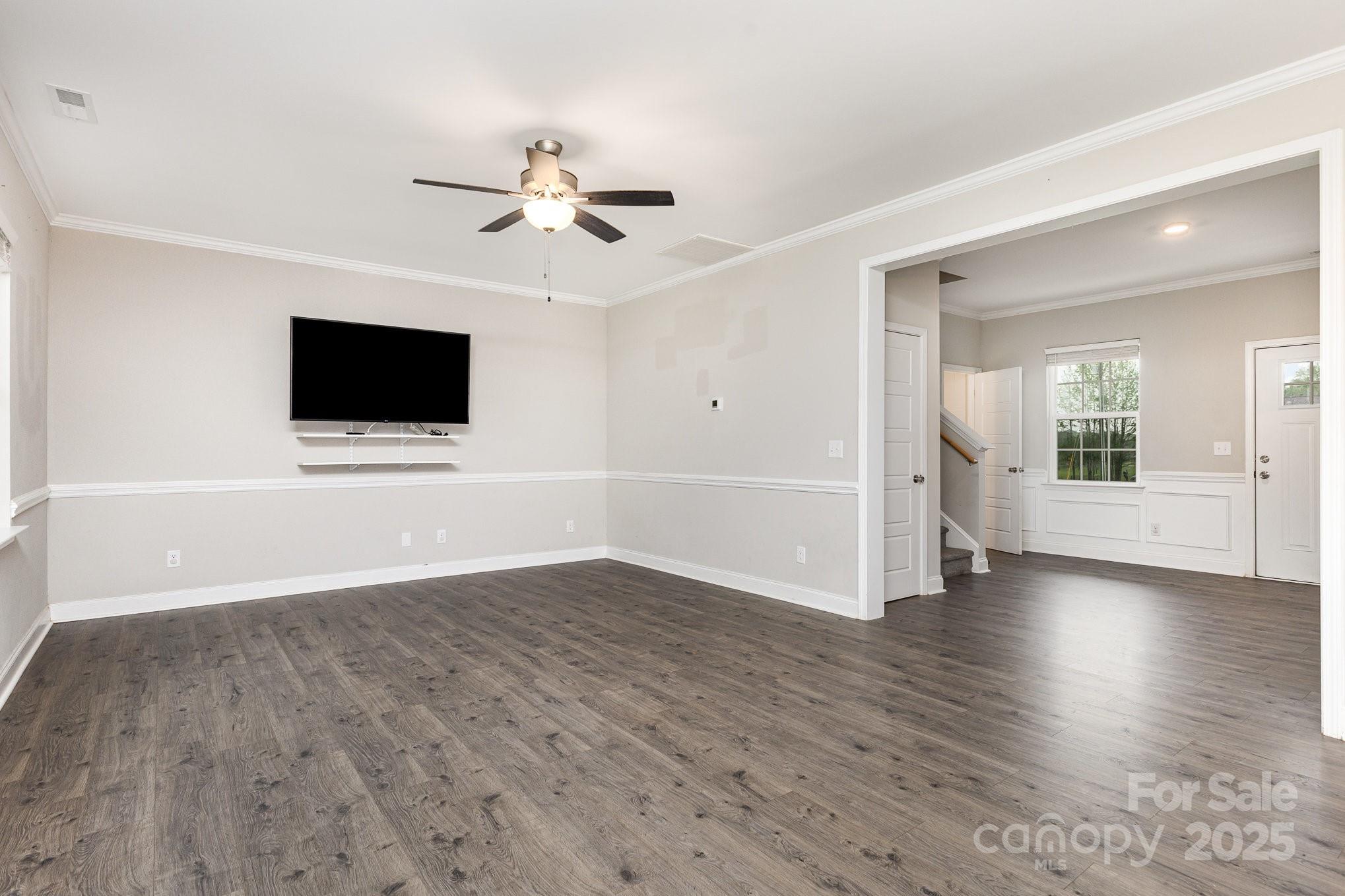 4026 Pigg Mattox Road Monroe, NC 28112 - Photo 6 of 31 a view of an empty room with window and wooden floor