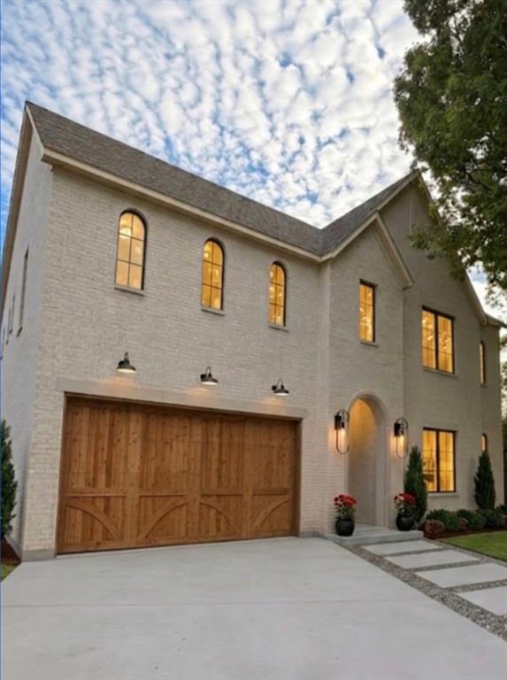 3830 Dunhaven Road Dallas, TX 75220 - Photo 1 of 21 a front view of a house with a yard
