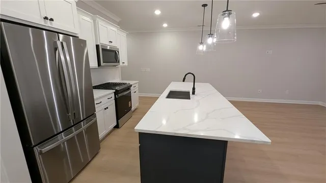 a bathroom with a double vanity sink and mirror with shower
