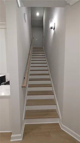 a bathroom with a double vanity sink a mirror and a shower