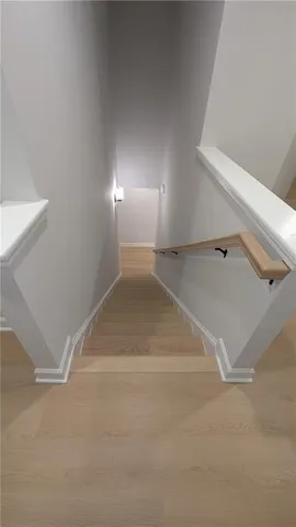 a spacious bathroom with a mirror and a sink