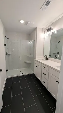 a bathroom with a sink toilet and mirror