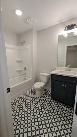 an aerial view of a house with a lake view