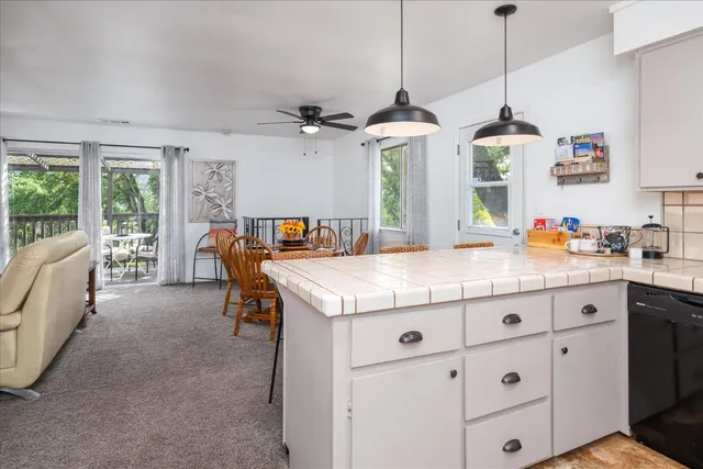 a view of center island with cabinets and couch