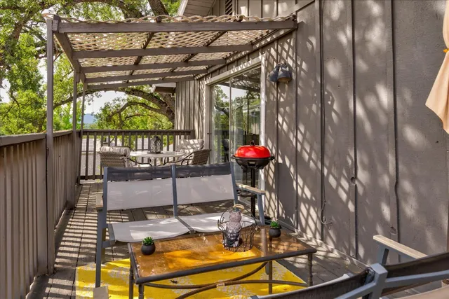 a view of a balcony with chairs
