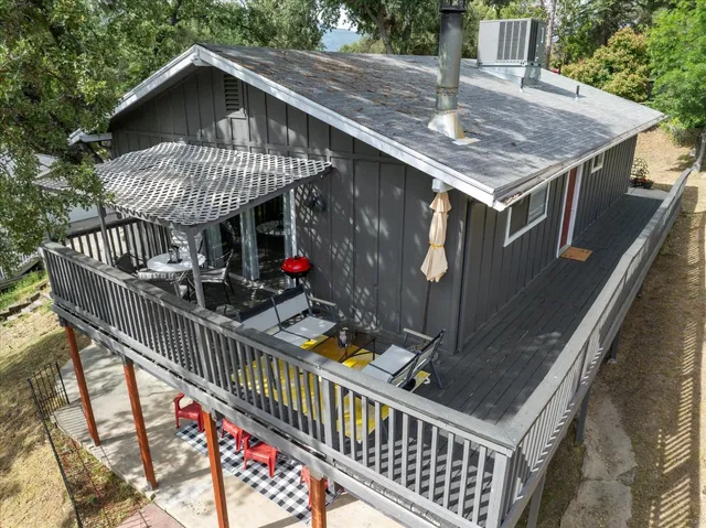 a view of a house with roof deck front of house