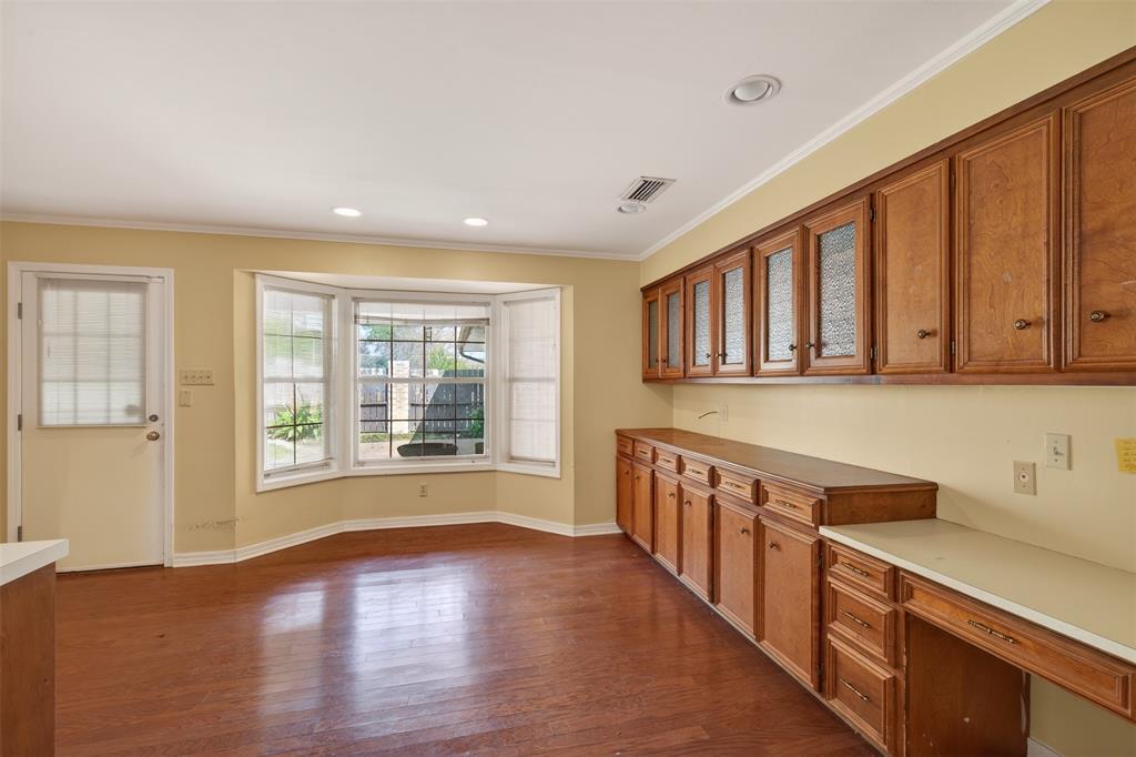 300 Pierremont Road, Unit 25 Shreveport, LA 71106 - Photo 16 of 34 a view of a kitchen with stainless steel appliances wooden floor and a large window