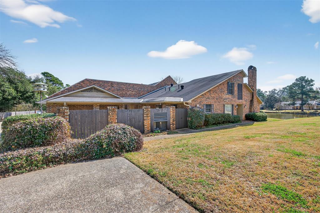 300 Pierremont Road, Unit 25 Shreveport, LA 71106 - Photo 34 of 34 a front view of a house with a yard and garage