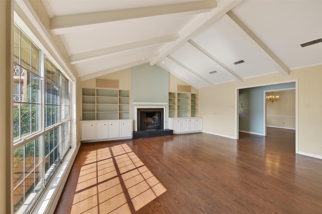 300 Pierremont Road, Unit 25 Shreveport, LA 71106 - Photo 6 of 34 wooden floor in an empty room with a fireplace