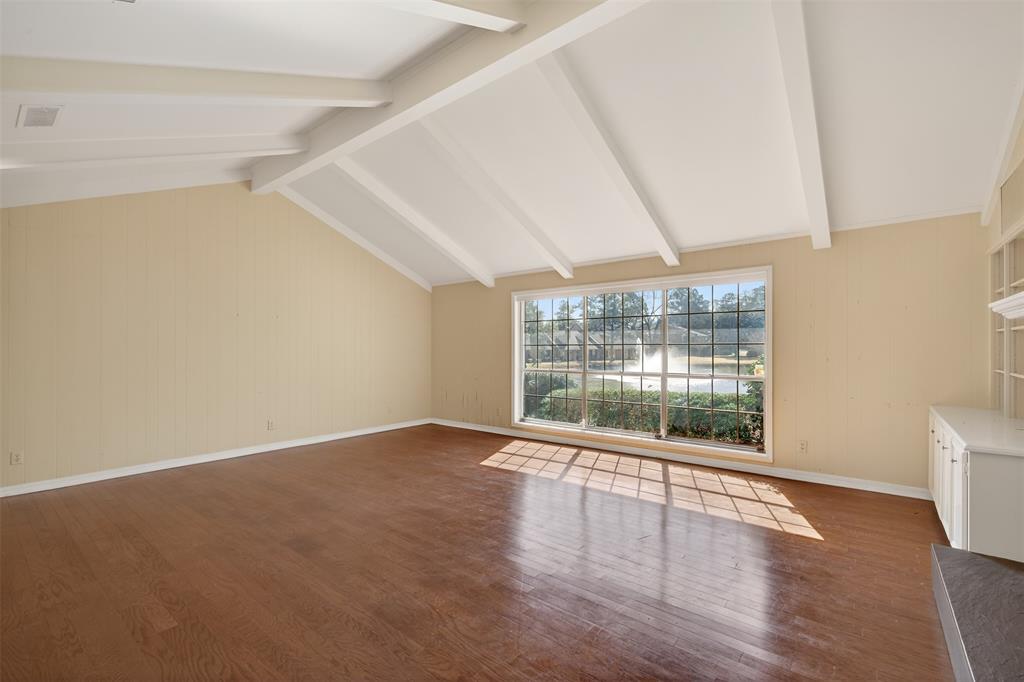 300 Pierremont Road, Unit 25 Shreveport, LA 71106 - Photo 8 of 34 wooden floor in an empty room with a window